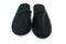 Pair of black indoor slippers isolate background