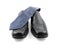 Pair of black male business shoes and blue tie