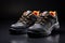 Pair of black safety leather shoes isolated on dark background. Work shoes for men in factory or industry to protect foot from