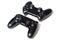 Pair of black video game controllers