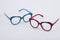 Pair of blue and pink plastic eyeglasses with spotted design
