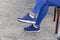 Pair Of Blue Sneakers On Feet