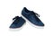 Pair of blue youth sneakers. White isolate