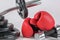 A pair of boxing gloves and dumbbells and weight plates
