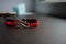 Pair bracelets in black and red with infinity. Handmade woven bracelets. Handmade decorations. Background with beads with hearts