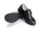 Pair of brand new black leather shoe for children on white