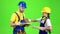Pair of builders choose wooden boards. Green screen. Slow motion