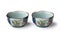 Pair of ceramic Japanese decorated small bowls on white background