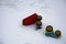 A pair of children`s toy cars thrown on the snow by children