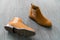 Pair of classic brown leather grooms shoes on the carpet photographed from above. Man fashion footwear background