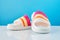 Pair of colorful multicolored rainbow flip flops or sandals on pastel background. beach holidays and Summer concept