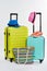 Pair of colorful wheeled suitcases.