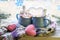 A pair of cups with a drink decorated with meringues and marshmallow snowmen, Christmas decor, hearts, a knitted scarf on the wind