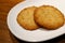 Pair of delectable butter cookies on a white plate