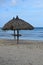 Pair of Deserted Palapas on a Beach in Aruba.