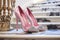 Pair of designer high-heels shoes positioned on marble staircase. Generative AI