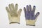 Pair of dirty gloves for gardening. dotted anti-skid surface