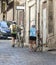 Pair of elderly cyclists on the street of the old city