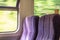 Pair of empty railway carriage seats seen on a commuter journey.