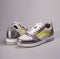 Pair of fashion sneakers shoes in ultimate gray and illuminating yellow colors of the year 2021