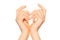 Pair of female hands making heart sign