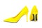 Pair of female yellow suede stiletto heel shoes on white background