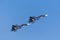 Pair of fighters flying in tight formation