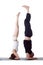 Pair of flexible yoga trainers doing handstand