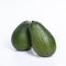 a pair of fresh avocados isolated on a white