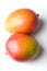 Pair of fresh juicy ripe mango tropical fruits