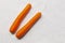 Pair of fresh orange carrots on a white background. Delicious healthy root for snack