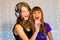 Pair of girls singing on karaoke