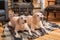 Pair of golden Labrador Retrievers lie on a blanket in front of country house fireplace