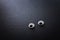 Pair googly eyes over black background