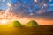 Pair of green touristic tent in a light of evening sun