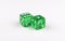 A pair of green, translucent gaming dice showing seven spots