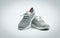 A pair of grey shoes on white background. Comfortable shoes with pore. Breathable rubber shoes. Footwear