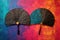 a pair of hand fans crossed on a vibrant, textured backdrop