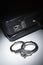 Pair of Handcuffs and Briefcase Under Spot Light