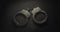 Pair of handcuffs used by law enforcement. Justice or catching a guilty criminal concept