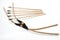 A pair of handmade wooden short bows with some arrows