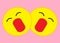 A pair of identical yellow smiley emoticons heads faces with an opened mouth and closed eyes expression light pink rose back