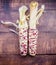 Pair of indian corn cobs on dark wood background