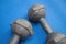 Pair of iron dumbbell 5 kilograms on blue yoga mat