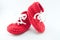 Pair of knitted, bright red baby booties