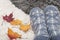 Pair of knitted socks with snowflakes and colorful autumn leaves of maplle