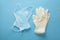 pair of latex surgical gloves and medical protective ear-loop masks