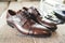 Pair of leather lace up shoes. Shiny brown man shoes side view. Wedding shoes.