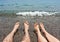 Pair legs on sea beach