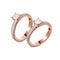 A pair of luxury rose gold rings with diamonds